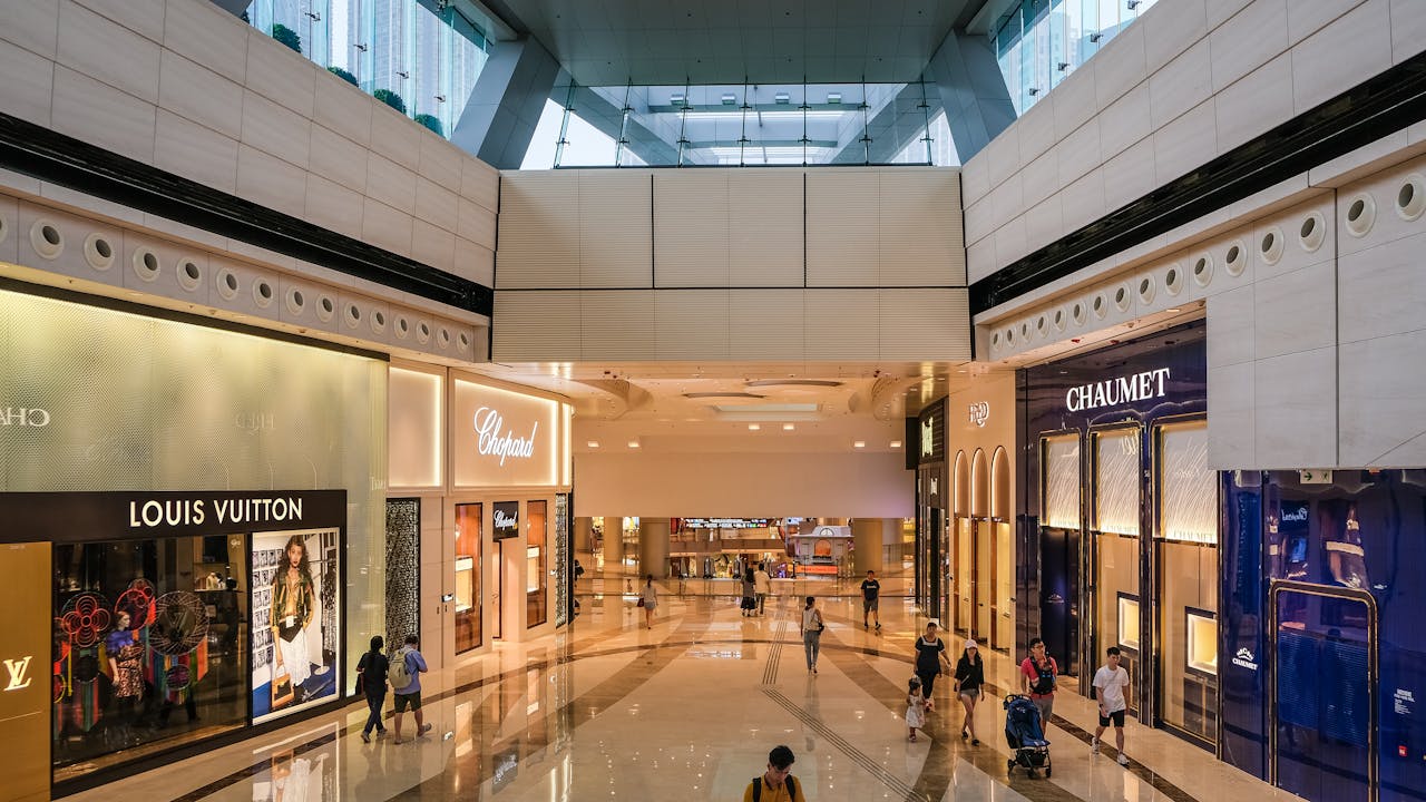 Explore the modern architecture of a luxury shopping mall in Hong Kong.
